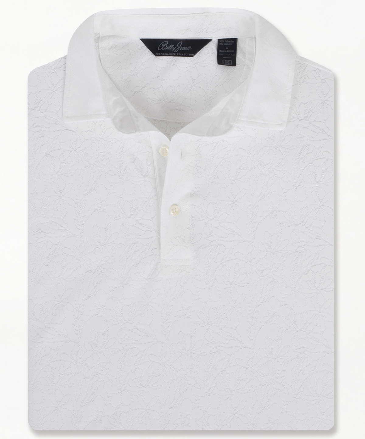 Bobby Jones men’s white jacquard golf polo with subtle floral pattern, short sleeves, and three-button placket, folded to highlight textured design and tailored collar.